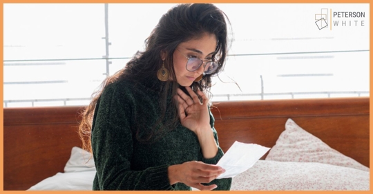 Woman looking over child support papers